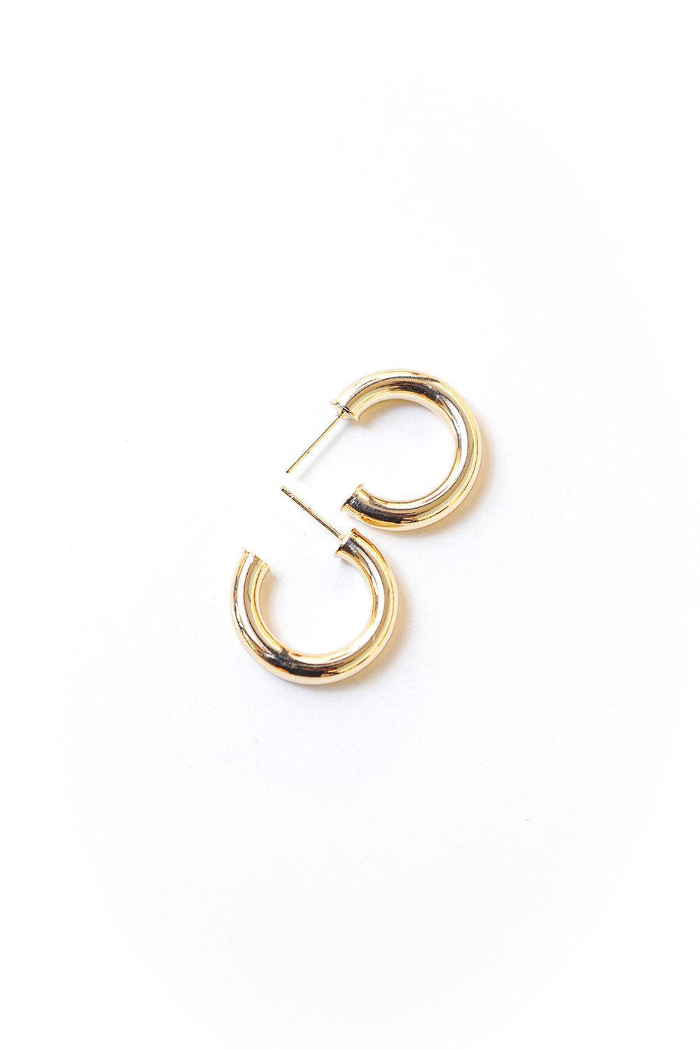 Gold tone classic hoop earrings with secure post fastening. 25mm in diameter