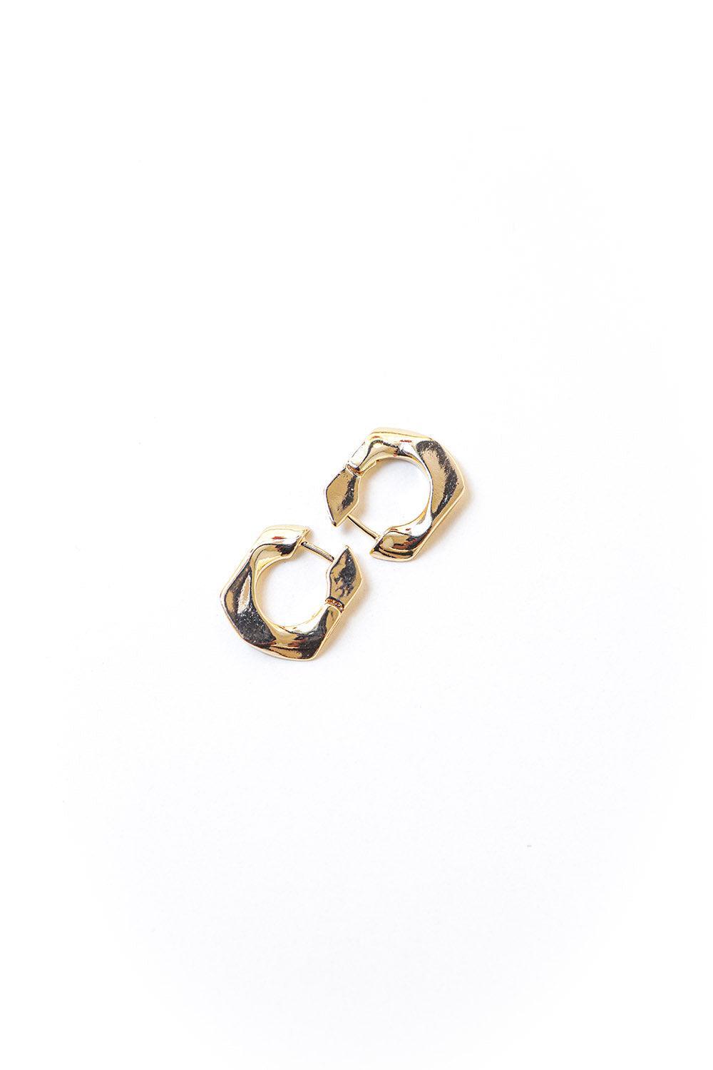 Gold tone mini huggie earrings with secure hinge enclosure. 20mm in diameter